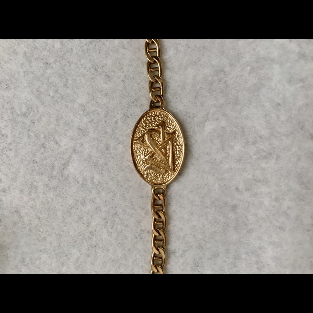 14k gold ID bracelet.